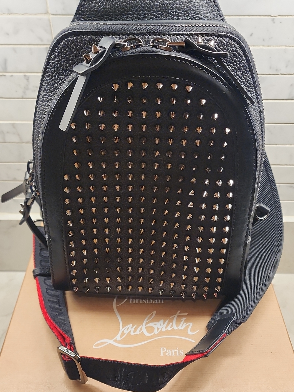 Christian Louboutin Black Leather Studded Sling Backpack with Red-Trim Strap